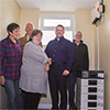 Ross McMilan [2nd from right] being shown the battery storage unit by Dilham Village Hall Trustees. [From left,Trottie Kirwan, Tony Kirwan, Hazel Furness and Simon Lake.