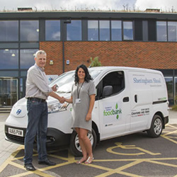 Timothy Hardy from Sheringham Shoal Offshore Wind Farm, handing over the keys to the Nissan electric van to Ella King from the Cromer and District Food Bank